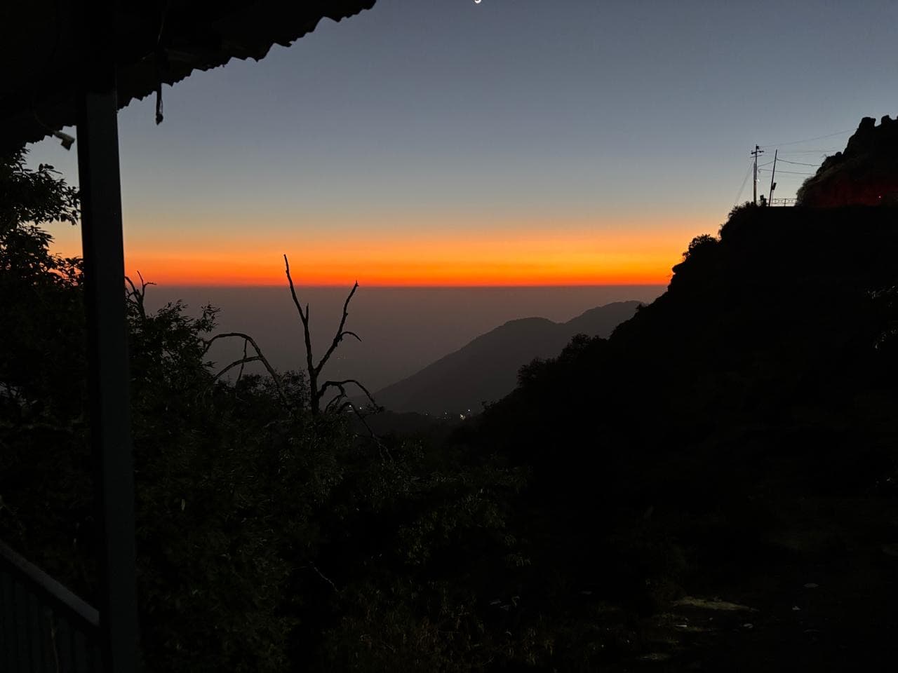 Sunset over the Doon valley from the verandah at Shail Shikhar, the ridge in silhouette